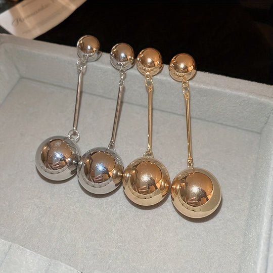 Elegant And Simple Golden Commuter Earrings With Round Tassels